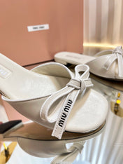 SLIDES SANDALS IN WHITE CALFSKIN BOW IN TRAP