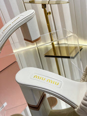 MIUMIU 26S PADDED MATELASSE MULE HEELS 65MM IN LIGHT BEIGE CALFSKIN GOLD HARDWARE