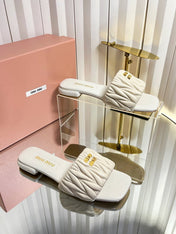 MIUMIU 26S MATELASSE SLIDES IN LIGHT BEIGE CALFSKIN GOLD HARDWARE
