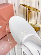 MIUMIU 26S FLAT MULES IN WHITE FABRIC AND LEATHER