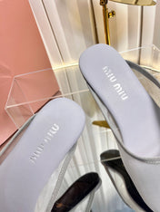 MIUMIU 26S FLAT MULES IN GREY FABRIC AND LEATHER
