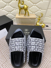 BALMAIN 25S BALMAIN MULES IN BLACK AND WHITE CALFSKIN