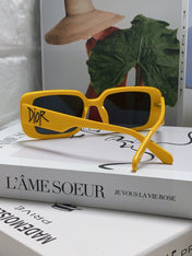 MONTAIGNE SUNGLASS 571593 IN YELLOW ACETATE TEXT LOGO