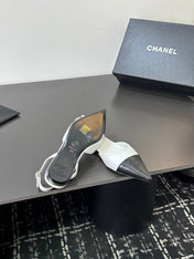 CHANEL 26S POINTED-TOE SLINGBACKS IN WHITE AND BLACK LAMBSKIN