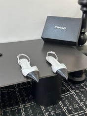 CHANEL 26S POINTED-TOE SLINGBACKS IN WHITE AND BLACK LAMBSKIN