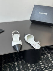 CHANEL 26S POINTED-TOE SLINGBACKS IN WHITE AND BLACK LAMBSKIN