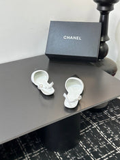 CHANEL 26S POINTED-TOE SLINGBACKS IN WHITE AND BLACK LAMBSKIN