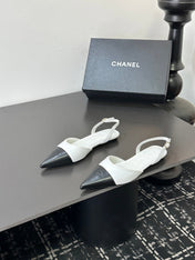 CHANEL 26S POINTED-TOE SLINGBACKS IN WHITE AND BLACK LAMBSKIN