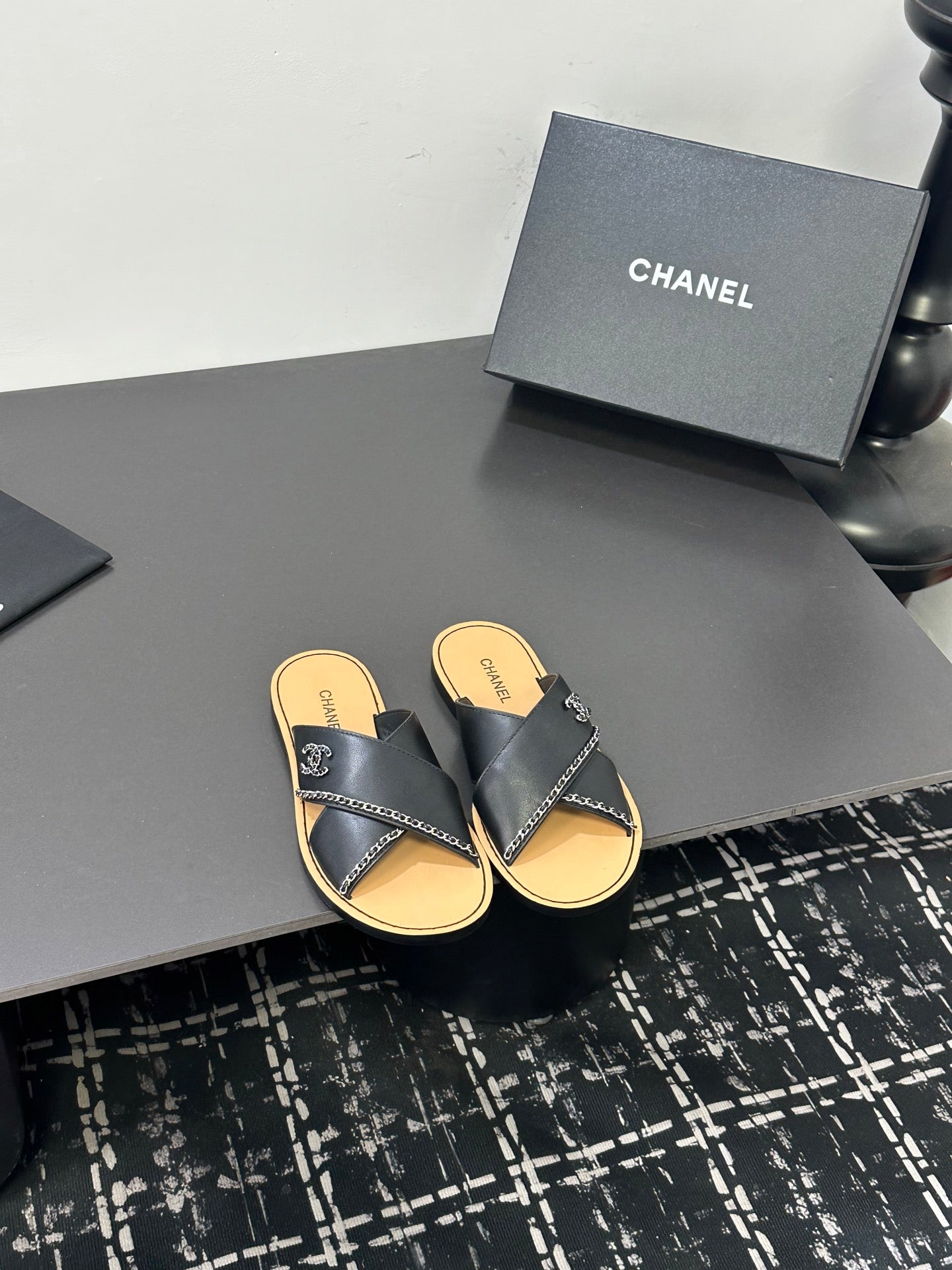 CHANEL 26S CROSS-STRAP SANDALS IN BLACK LEATHER