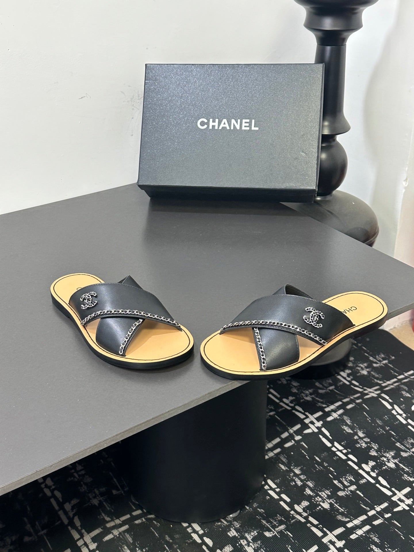CHANEL 26S CROSS-STRAP SANDALS IN BLACK LEATHER