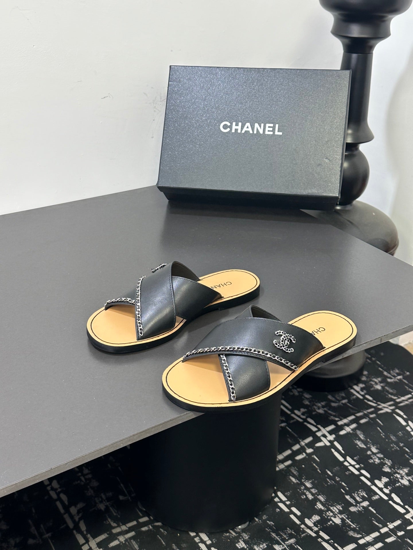 CHANEL 26S CROSS-STRAP SANDALS IN BLACK LEATHER