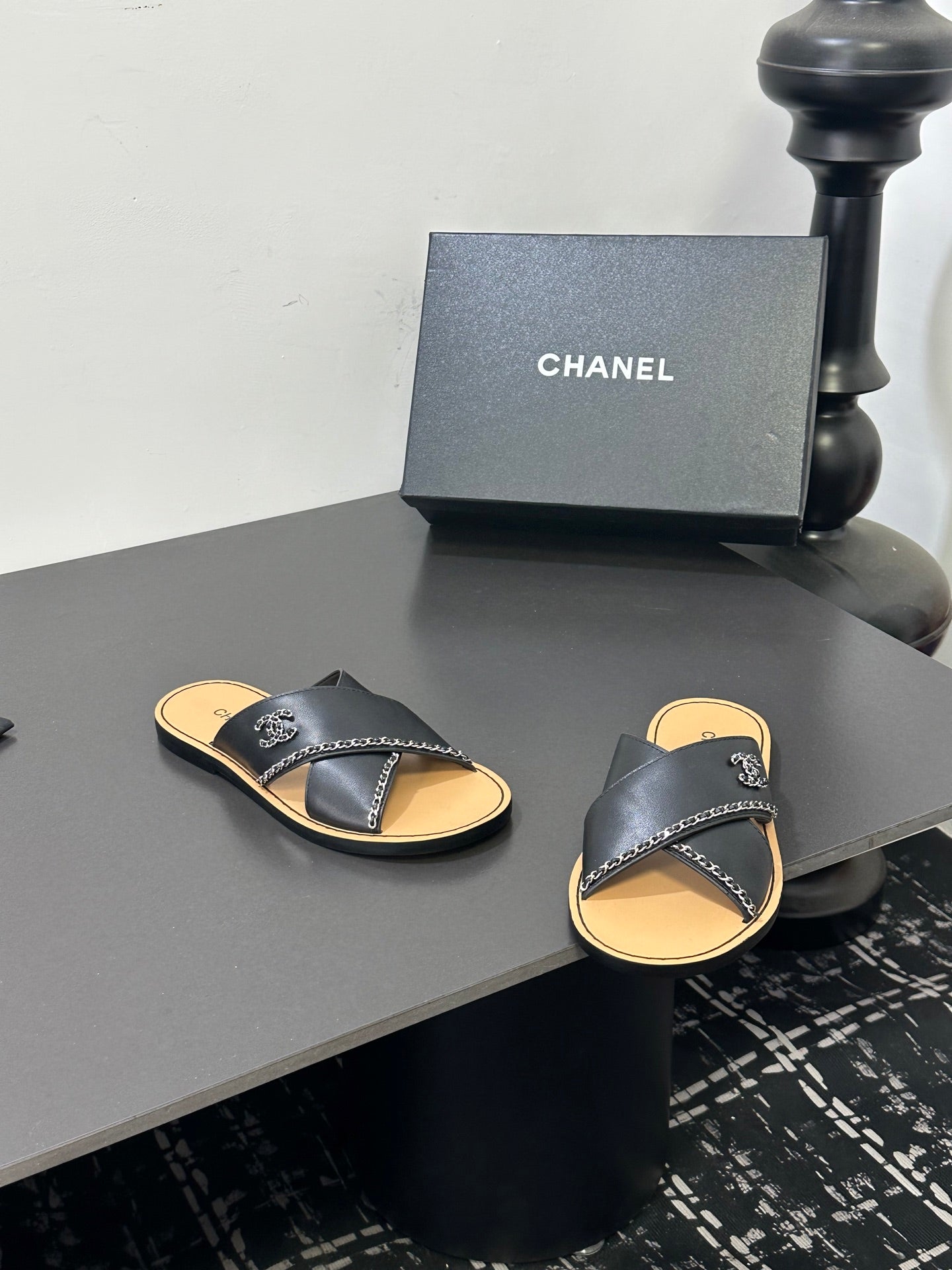 CHANEL 26S CROSS-STRAP SANDALS IN BLACK LEATHER
