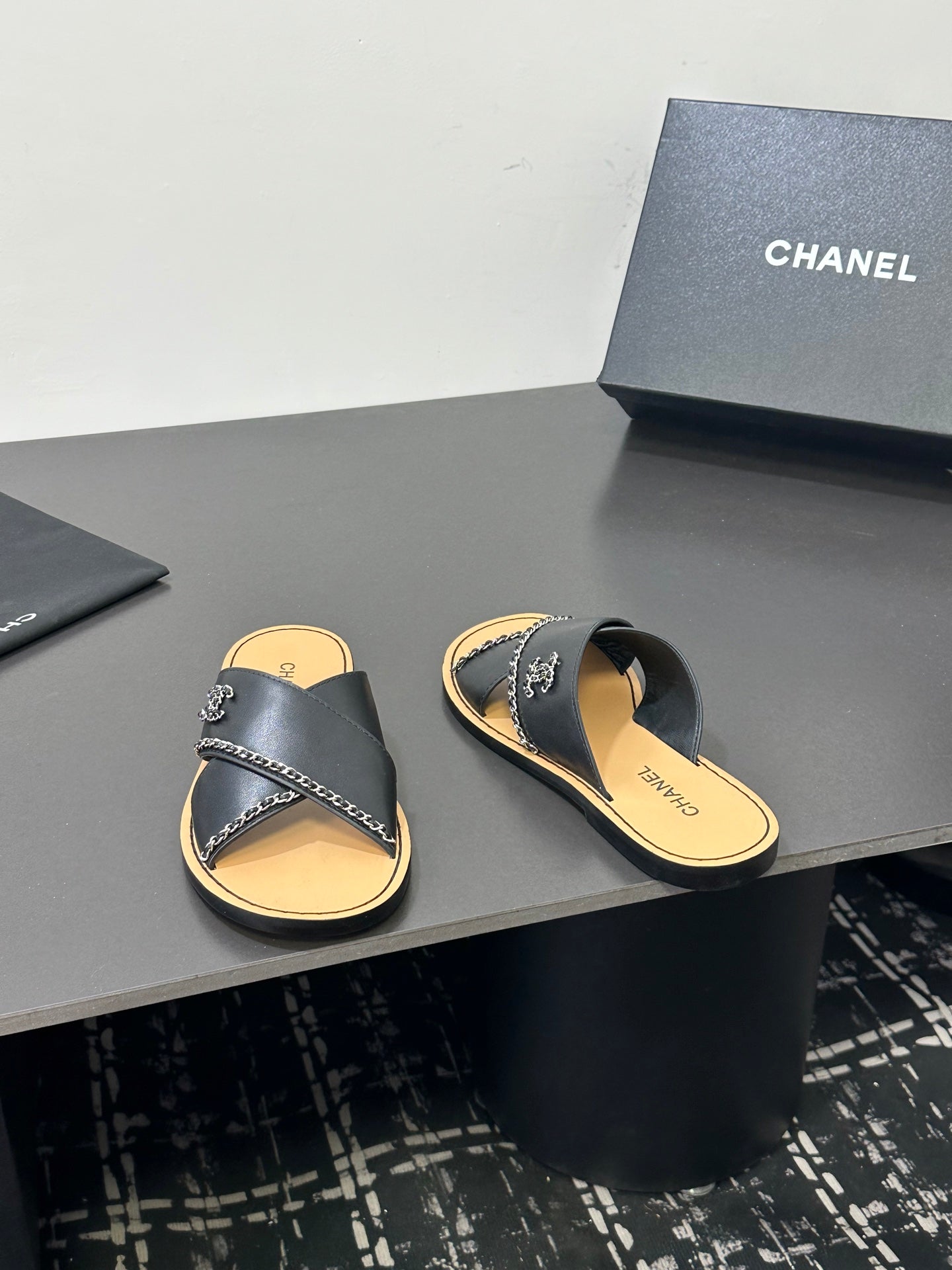 CHANEL 26S CROSS-STRAP SANDALS IN BLACK LEATHER