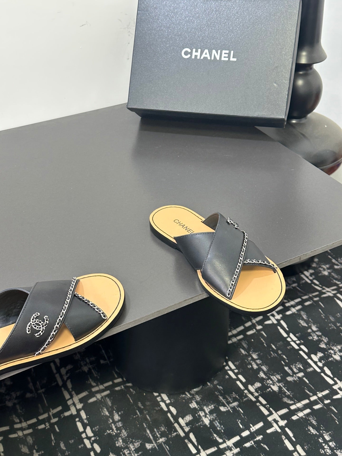 CHANEL 26S CROSS-STRAP SANDALS IN BLACK LEATHER