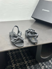 CHANEL 26S BOW SANDALS IN BLACK CALFSKIN