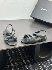 CHANEL 26S BOW SANDALS IN BLACK CALFSKIN