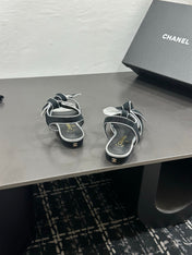 CHANEL 26S BOW SANDALS IN BLACK AND SILVER SUEDE