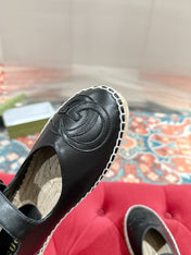 GG CROSS STRAP FLAT SHOES IN BLACK CALFSKIN WITH STRAW SOLE