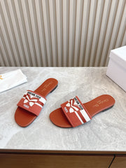 DIOR FLAT SLIDES 25S IN DARK ORANGE CALFSKIN AND FABRIC BRAND NAME EMBROIDERY
