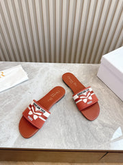 DIOR FLAT SLIDES 25S IN DARK ORANGE CALFSKIN AND FABRIC BRAND NAME EMBROIDERY
