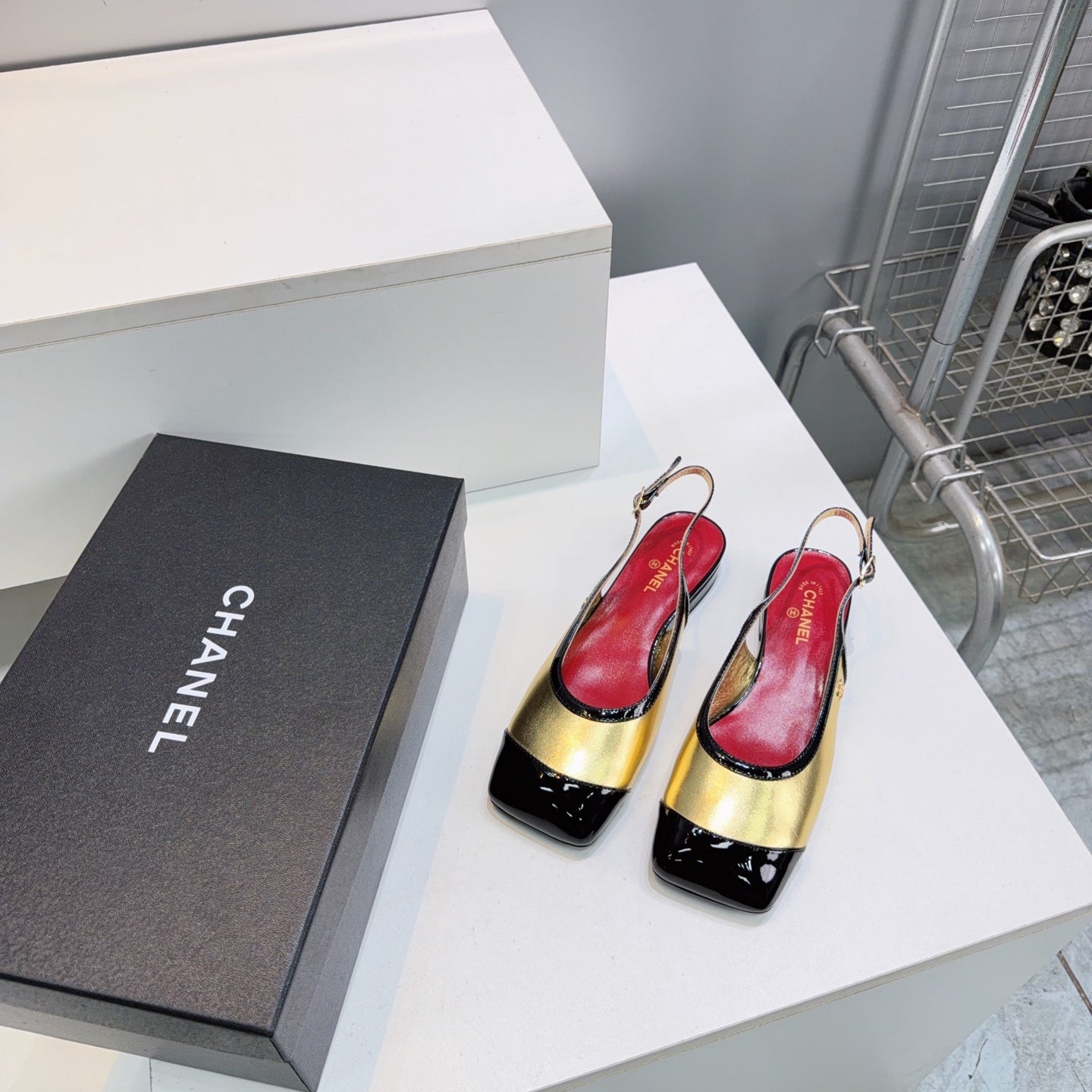 CHANEL 26S SLINGBACK PUMPS IN BLACK AND GOLD PATENT LAMBSKIN