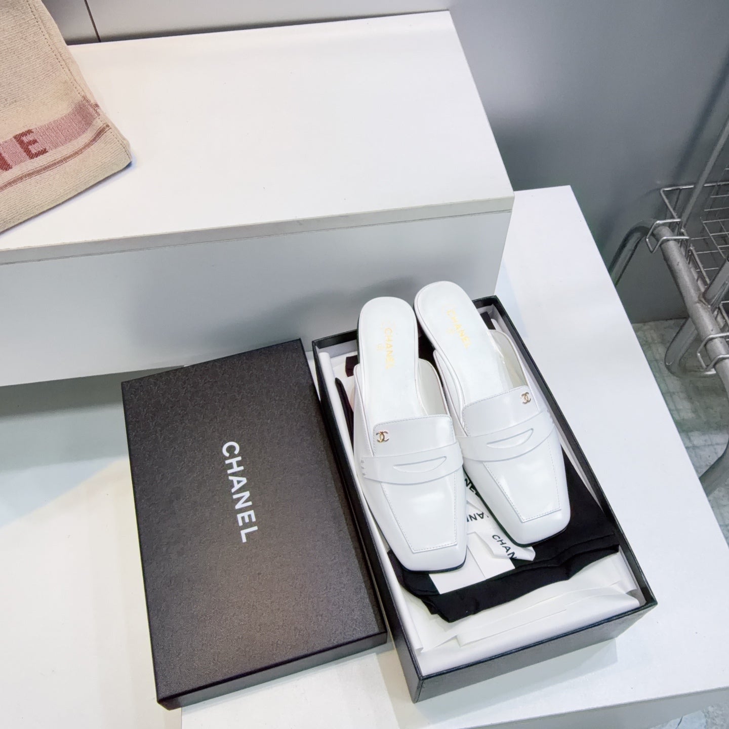 CHANEL 26S LOAFER MULES IN WHITE SHINY LAMBSKIN
