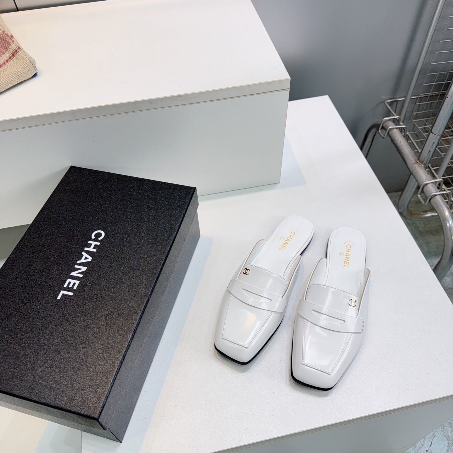 CHANEL 26S LOAFER MULES IN WHITE SHINY LAMBSKIN