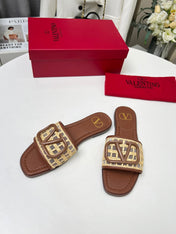 Vlogo embellished leather-trimmed raffia slides tan