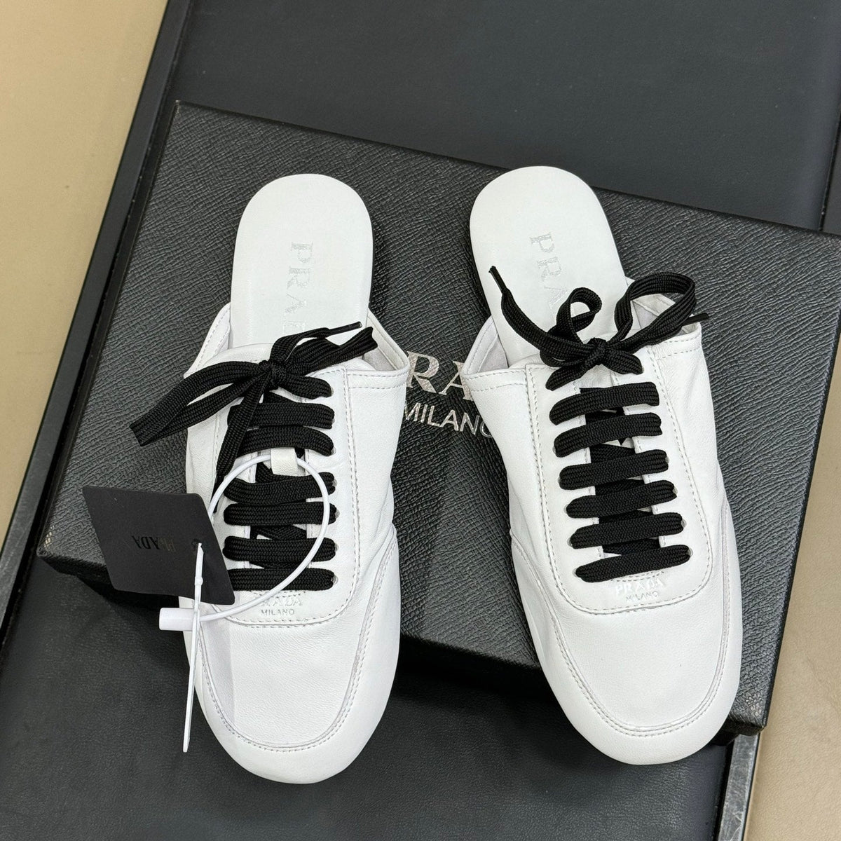 PRADA 25S COLLAPSE MULES IN WHITE CALFSKIN