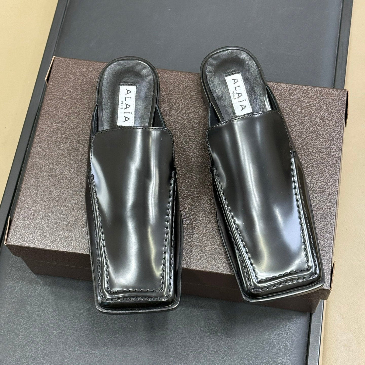 ALAIA 25S SQUARE LOAFER MULES IN BLACK GLOSSY CALFSKIN