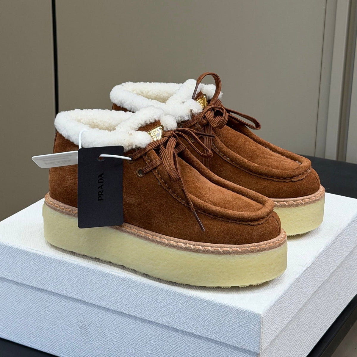 PRADA 25S HIGH-TOP SHOES 40 MM IN DARK BROWN SUEDE SHEARLING-LINED