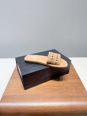 ALAIA FLAT SANDALS WITH PERFORATED STRAPS 25S IN BEIGE SUEDE