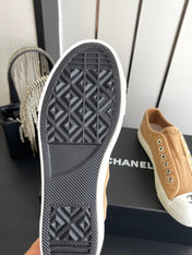 CHANEL 26S LOW TOP BEIGE IN NAVY BLUE CANVAS
