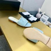 BOW SLIPPERS IN LIGHT BLUE LAMBSKIN