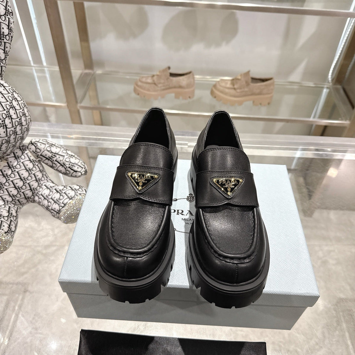 PRADA 25S THICK-SOLE LOAFERS 60 MM IN BLACK SMOOTH CALFSKIN