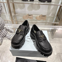 PRADA 25S THICK-SOLE LOAFERS 60 MM IN BLACK SMOOTH CALFSKIN