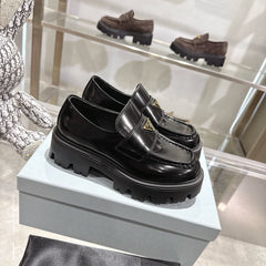PRADA 25S THICK-SOLE LOAFERS 60 MM IN BLACK CALFSKIN