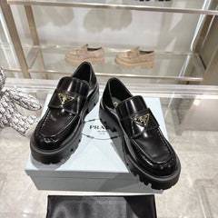 PRADA 25S THICK-SOLE LOAFERS 60 MM IN BLACK CALFSKIN