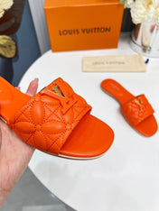 LV 26S MARE FLAT MULES IN ORANGE CALFSKIN