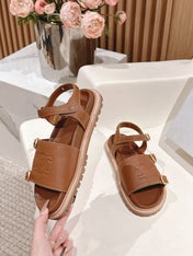 FLAT SANDALS IN RUST BROWN TRIOMPHE EMBOSSED SMOOTH CALFSKIN