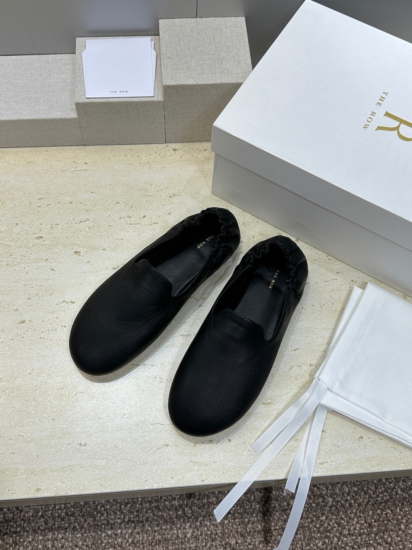 THE ROW 26S BALLET FLATS IN BLACK CALFSKIN