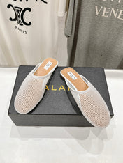 ALAIA FLAT MULES IN WHITE MESH FISHNET