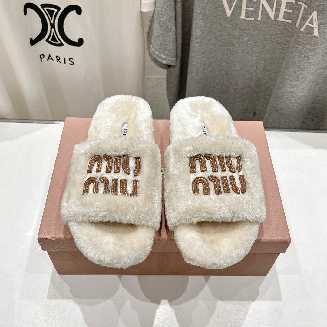 MIUMIU 26S FLAT SLIDES IN CREAM BEIGE SHEARLING