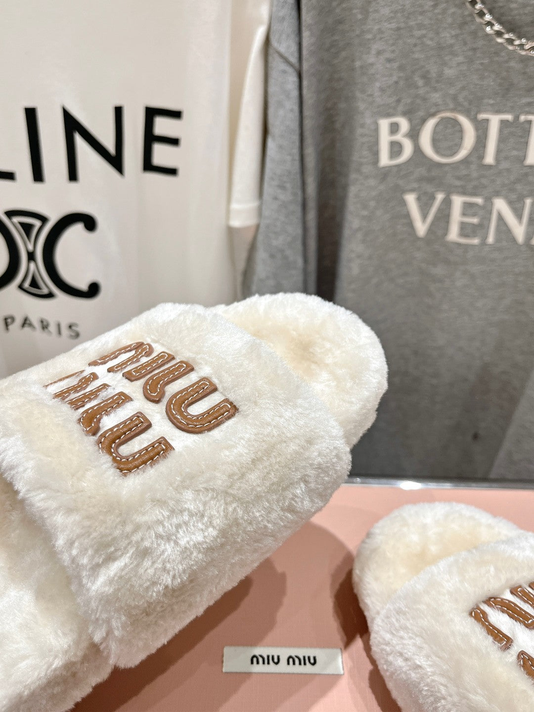 MIUMIU 26S FLAT SLIDES IN CREAM BEIGE SHEARLING