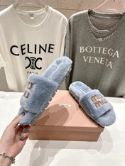 MIUMIU 26S FLAT SLIDES IN PASTEL BLUE SHEARLING
