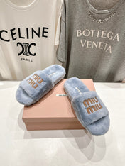 MIUMIU 26S FLAT SLIDES IN PASTEL BLUE SHEARLING