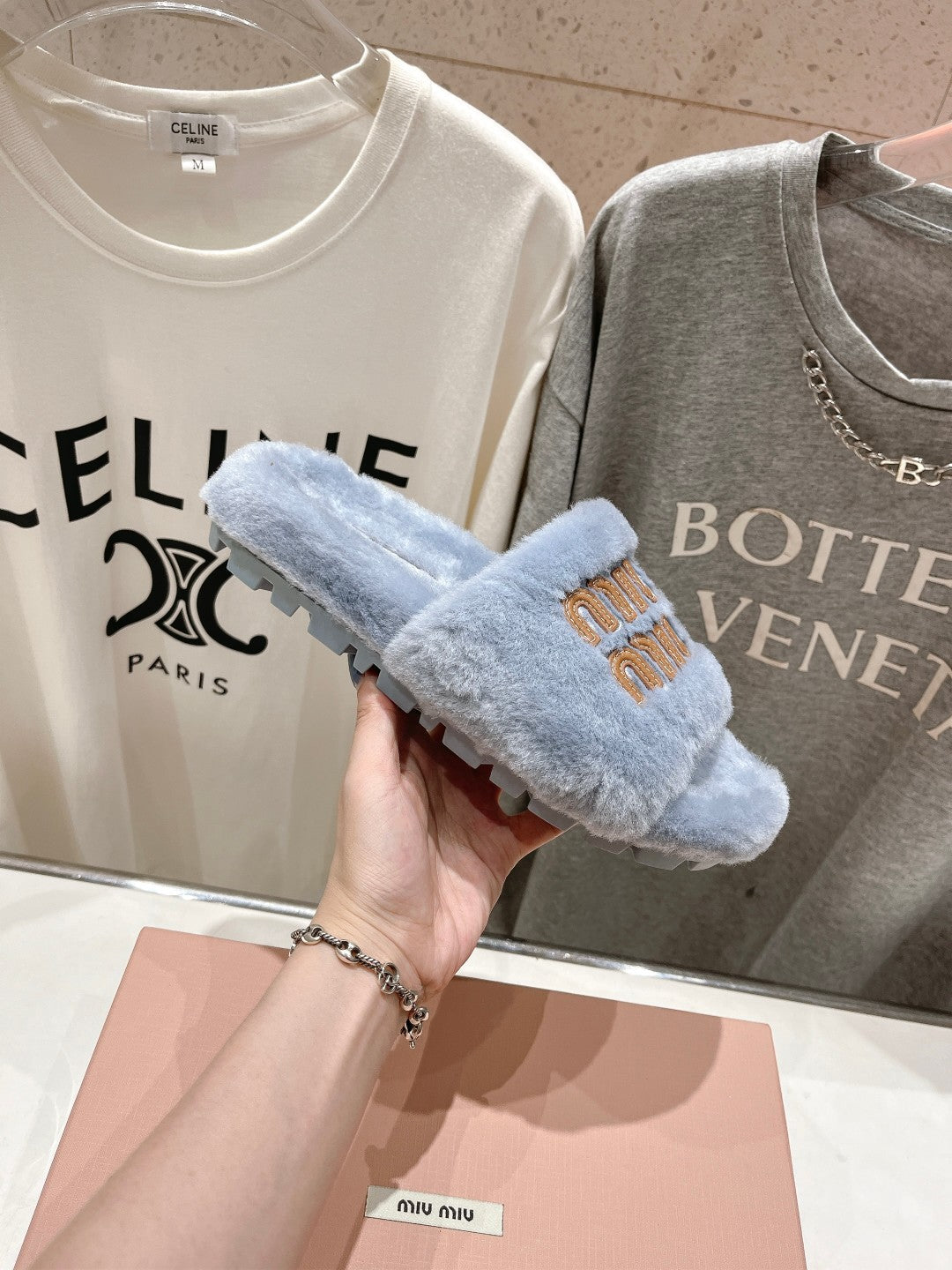 MIUMIU 26S FLAT SLIDES IN PASTEL BLUE SHEARLING