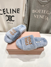 MIUMIU 26S FLAT SLIDES IN PASTEL BLUE SHEARLING