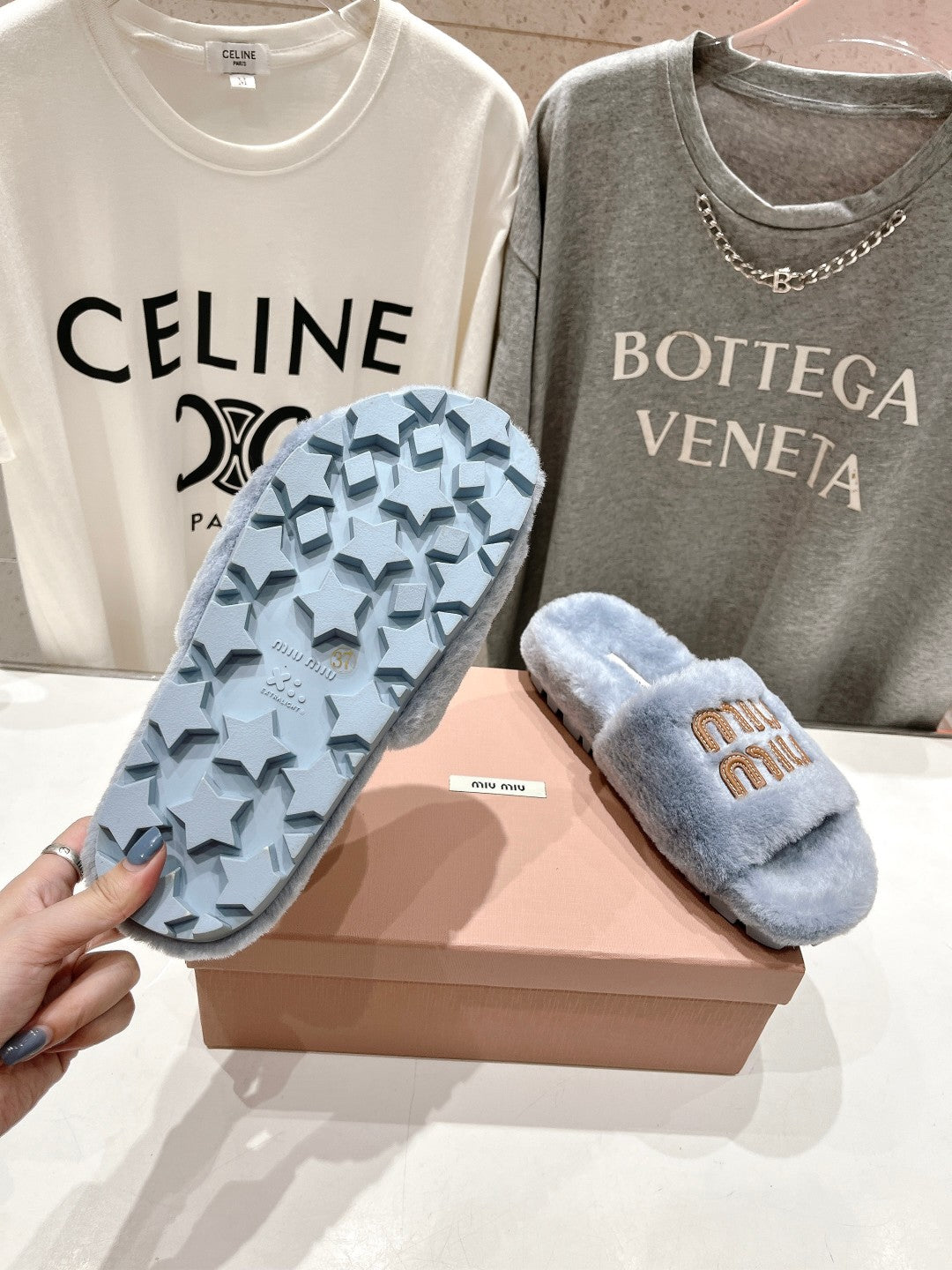 MIUMIU 26S FLAT SLIDES IN PASTEL BLUE SHEARLING