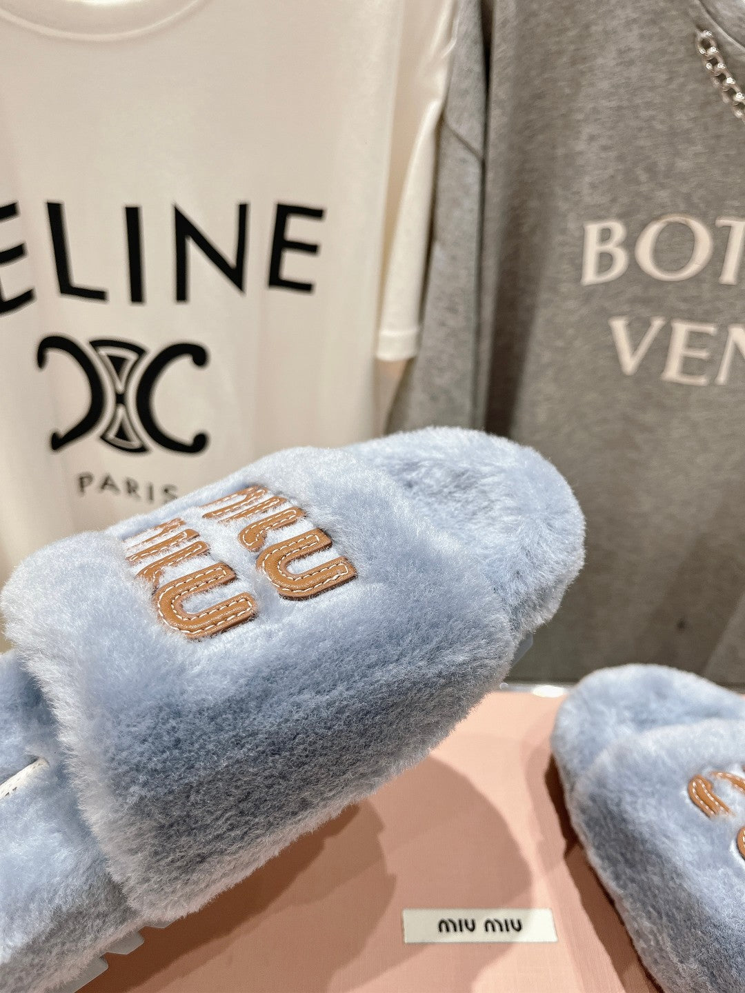 MIUMIU 26S FLAT SLIDES IN PASTEL BLUE SHEARLING